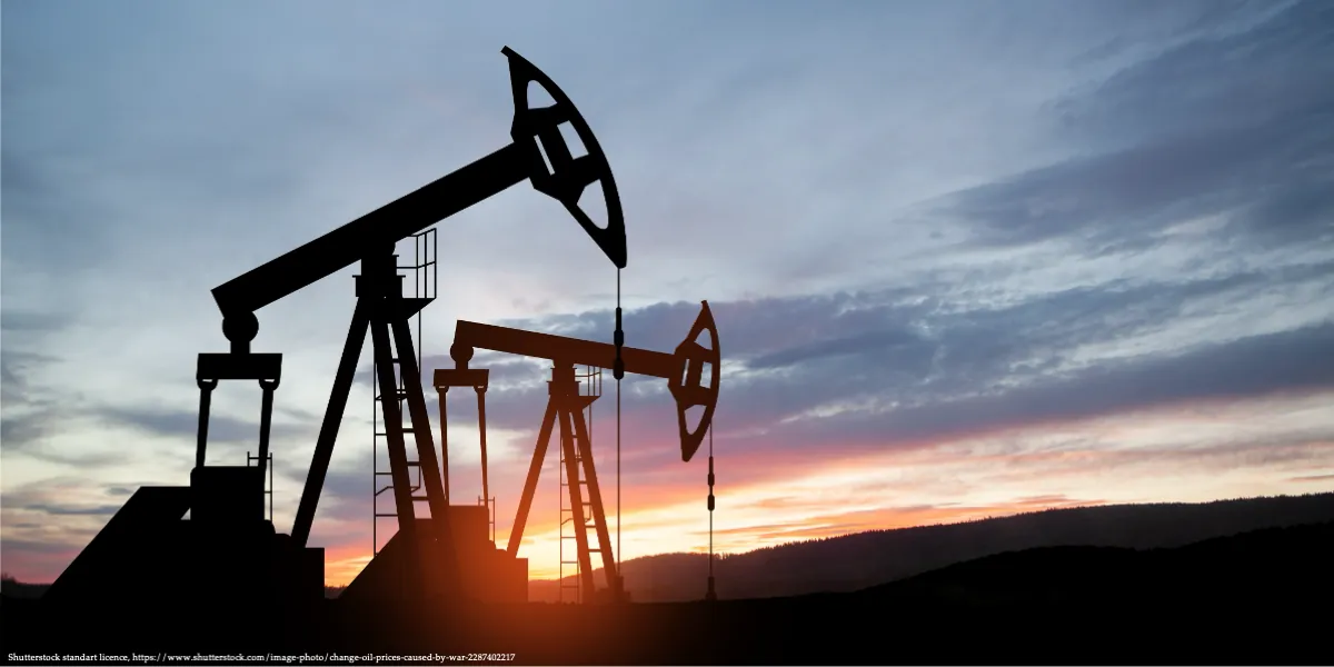 Oil pump jacks silhouetted at sunset representing Oil Crisis Energy Transition in the global energy sector.