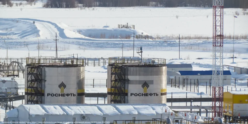 Rosneft oil storage tanks in a snowy industrial area, illustrating Russia’s budget strain due to dependence on oil revenues.