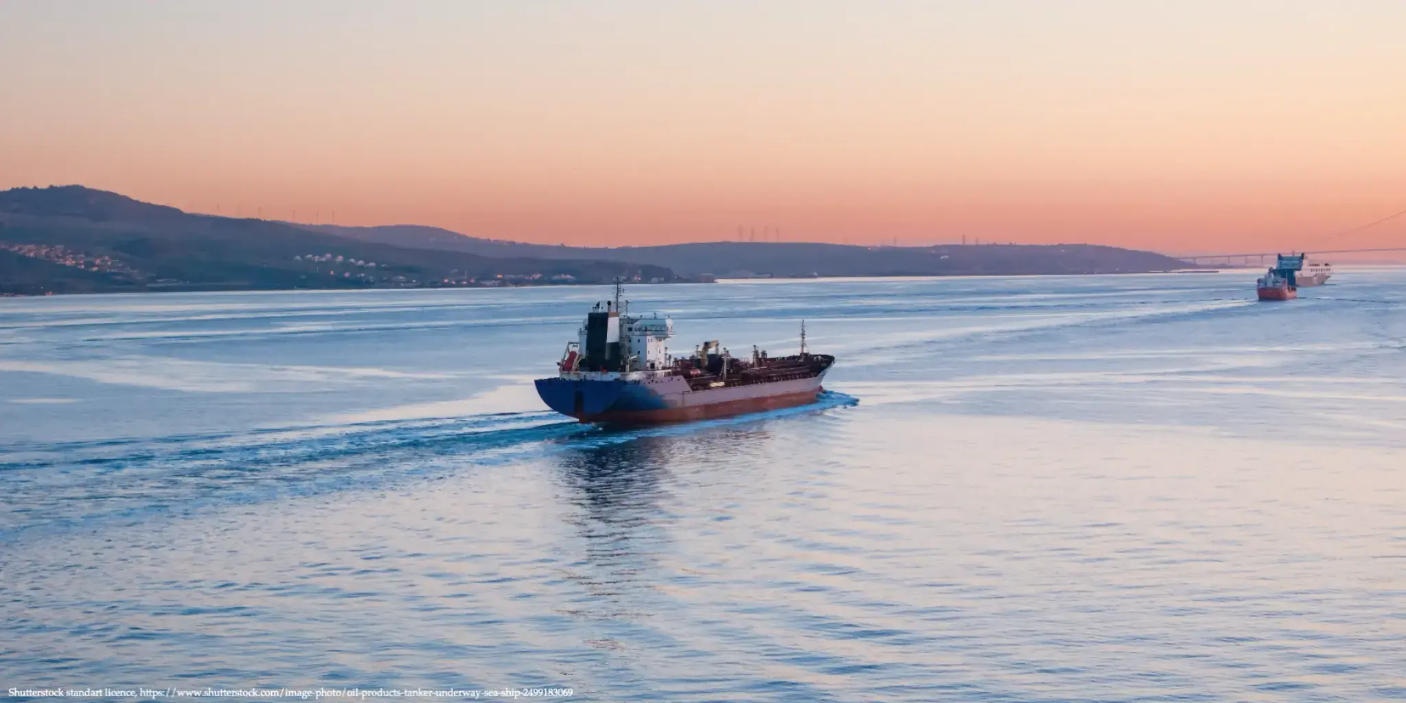 Oil tanker near the Strait of Hormuz at sunset amid concerns over the Russia oil revenue increase due to the Iran Crisis.